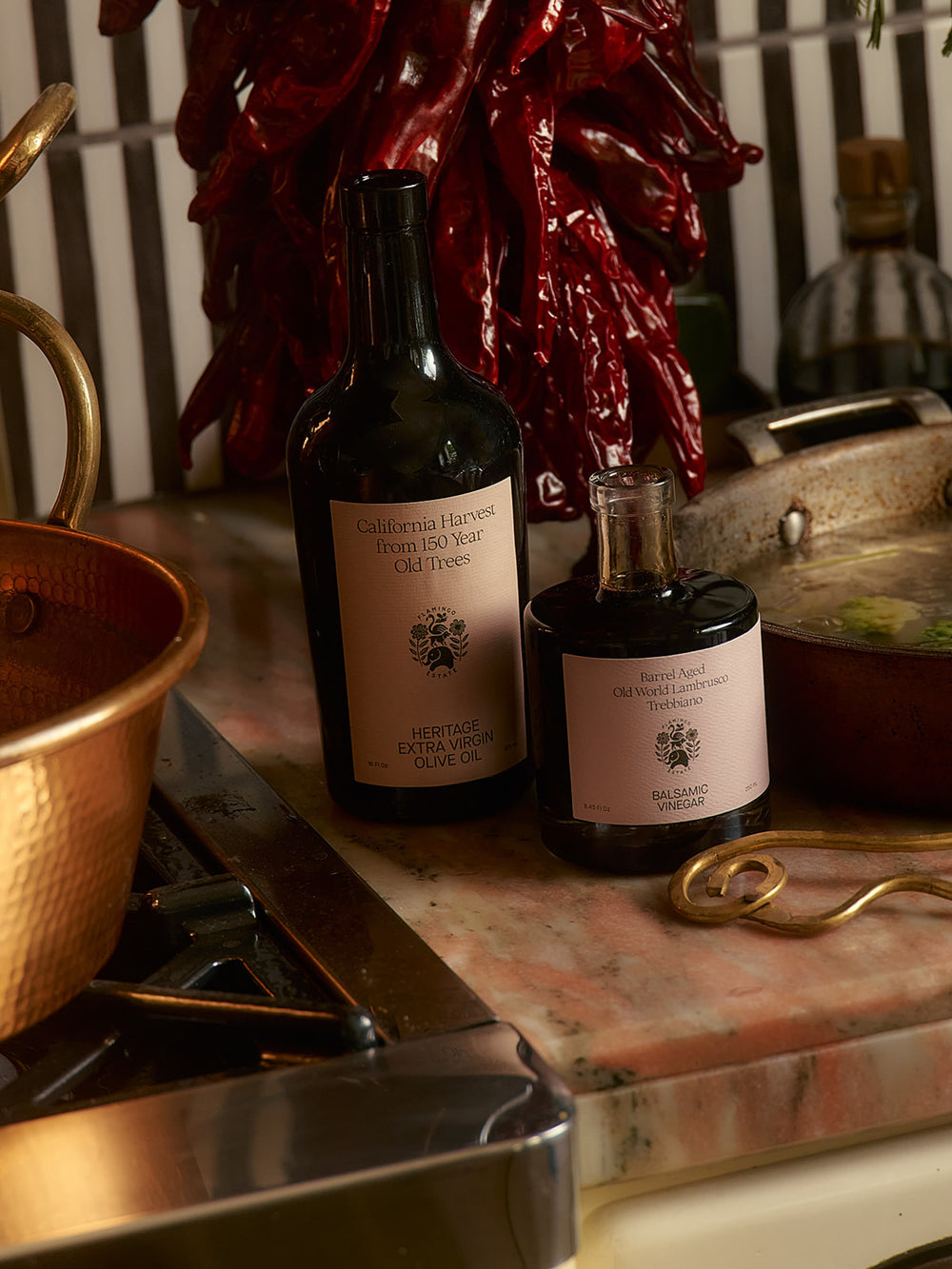 Bottles of olive oil and balsamic vinegar. Text: