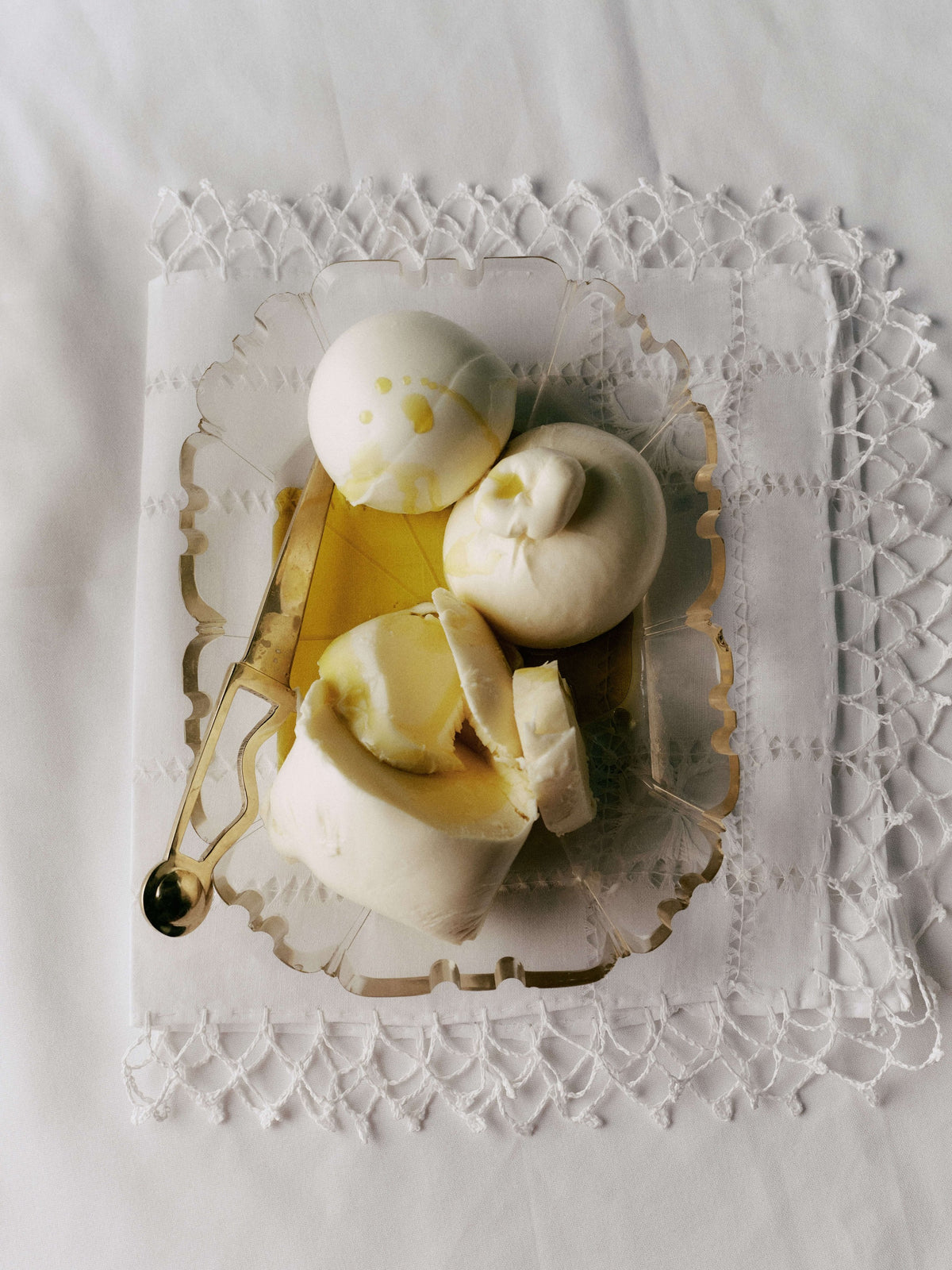 Soft cheeses and a pat of butter, topped with Heritage Extra Virgin Olive Oil.