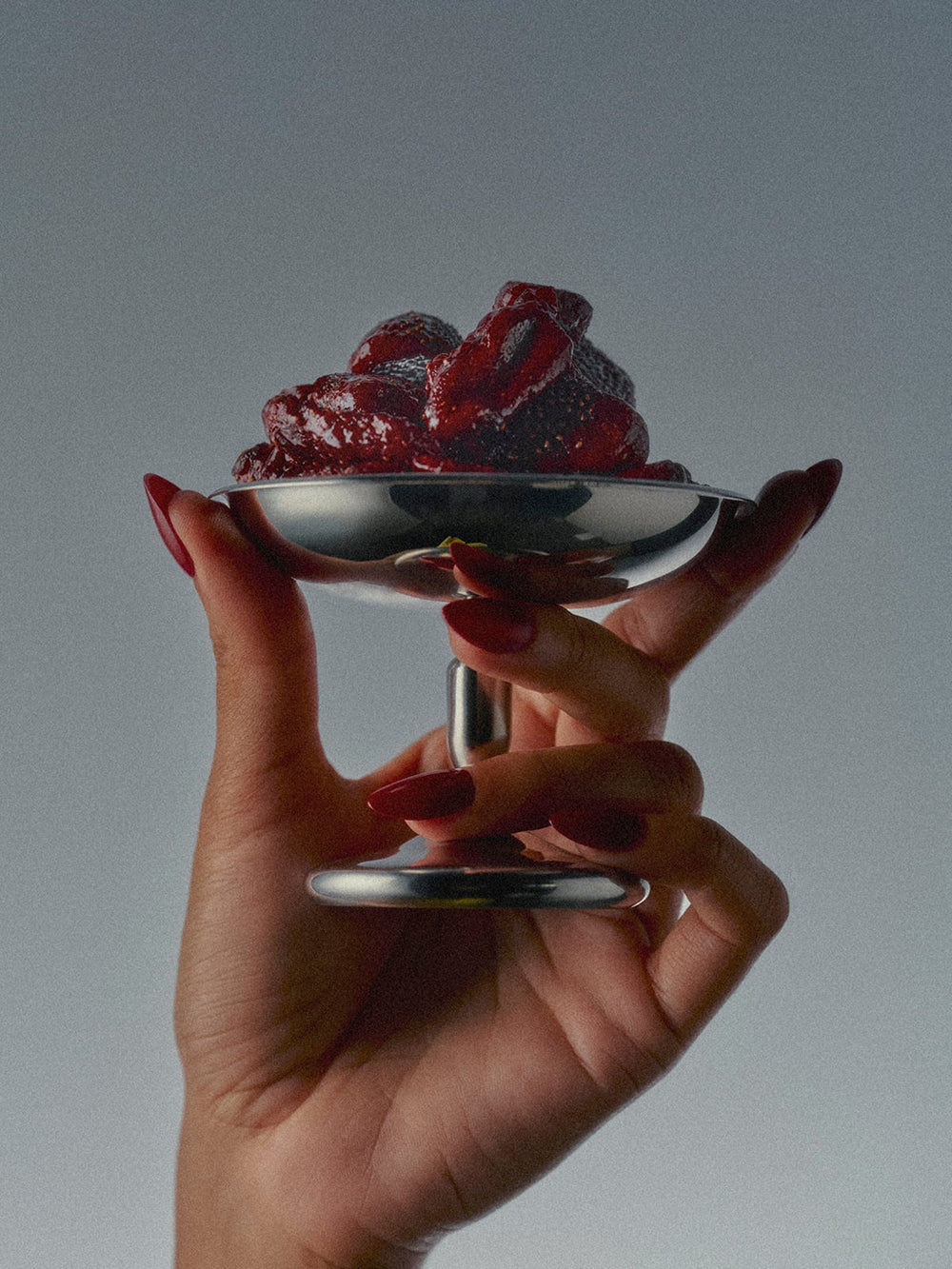 A Metalic Glass of Flamingo Estate Spicy Strawberry Fruit Snack