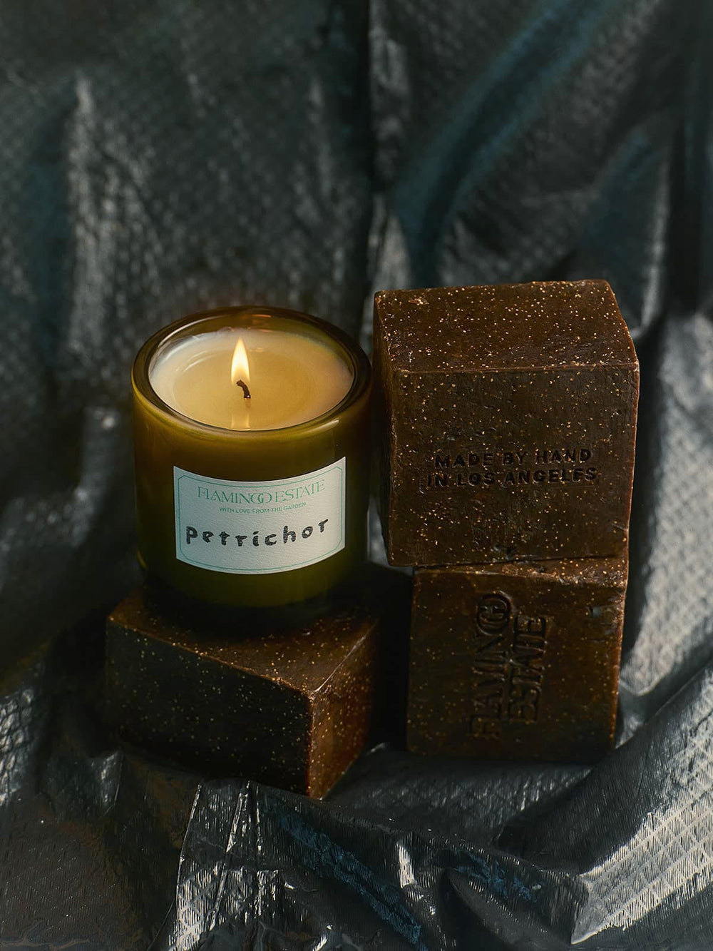 A lit candle labeled 