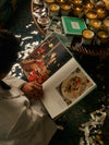 The Bookworm Set arranged on a table with wine and cozy decor, creating a warm, inviting scene