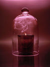 Candle on a glass table
