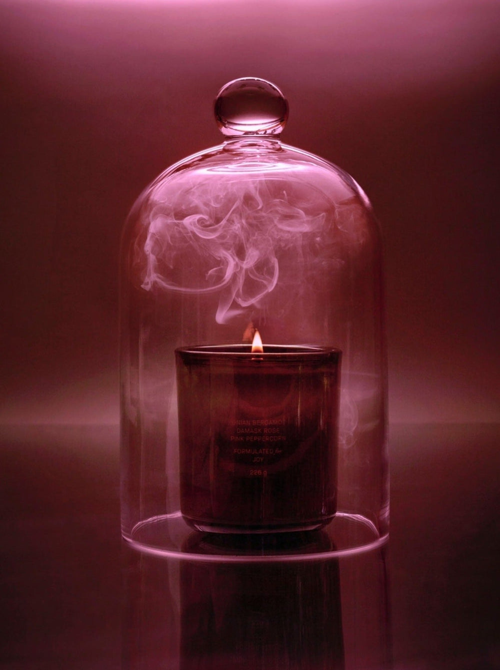 Candle on a glass table