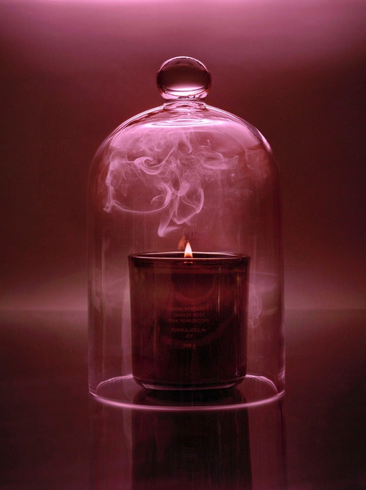 Candle on a glass table