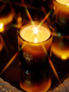 Sage Candle burning with a warm glow, highlighting its calming, aromatic quality.